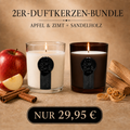 Zwei brennende AURÉNA-Duftkerzen mit jeweils 220 g: links im transparenten Glas mit Apfel und Zimt, rechts im dunkelbraunen Amberglas mit Sandelholz. Das 2er-Bundle kostet 29,95 €.